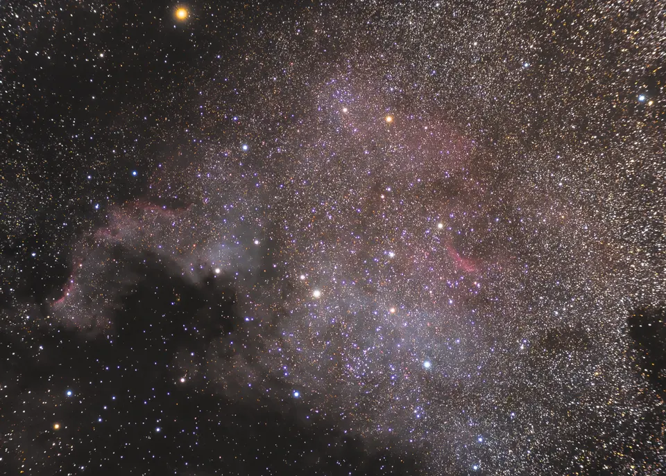 NGC 7000, the North America Nebula, photographed among the dense star fields of the Milky Way.